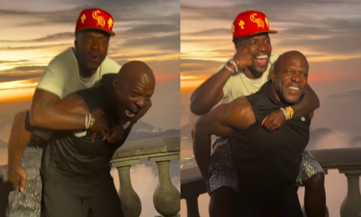 Terry Crews se aproxima de Vini Jr no Cristo Redentor, com um sorriso e um gesto de solidariedade.