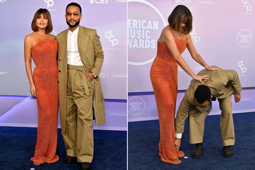 Chrissy Teigen tropeça no tapete vermelho do AMAs 2026, reagindo com humor e elegância.